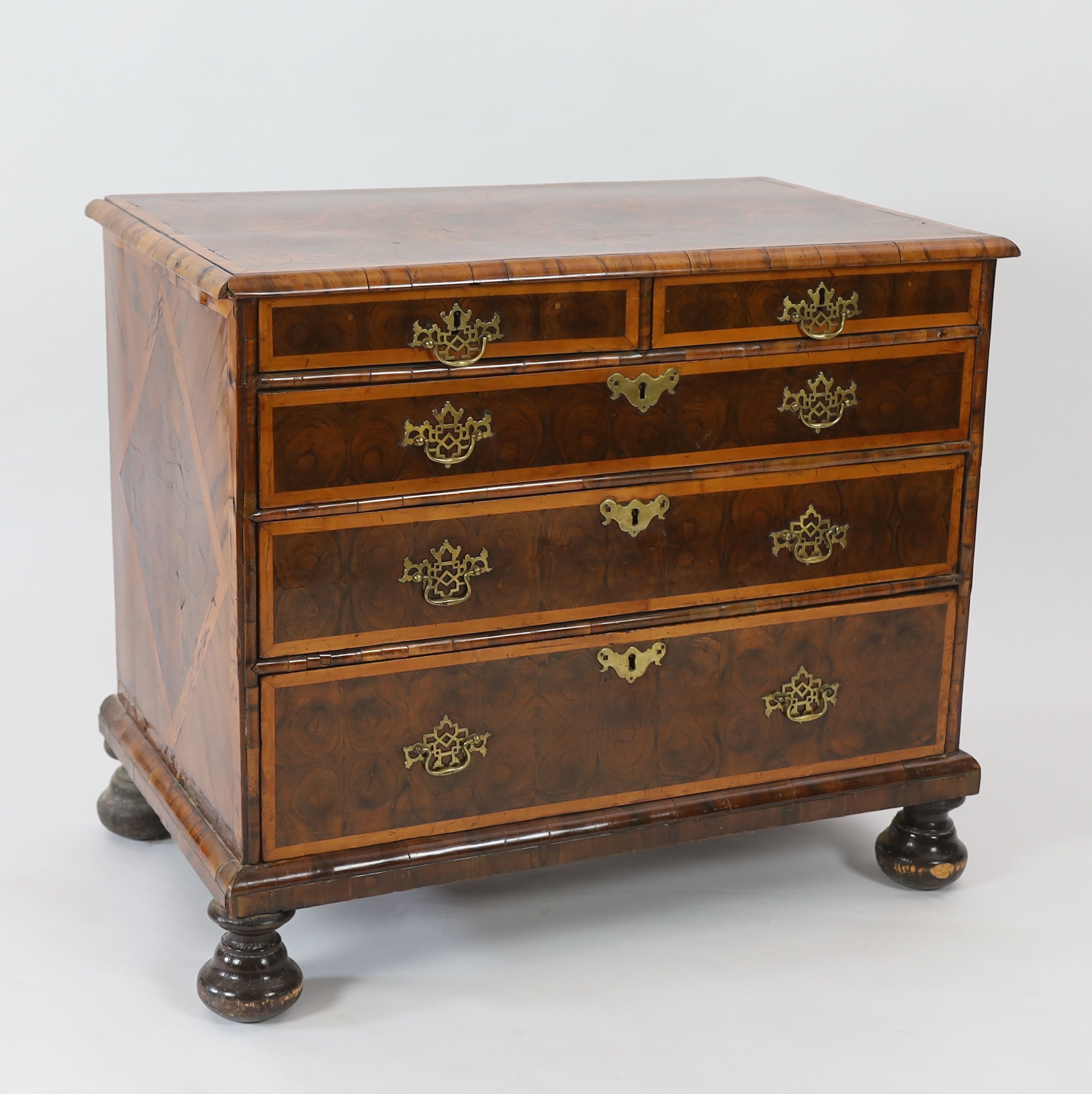 A William and Mary oyster veneered laburnum and walnut chest